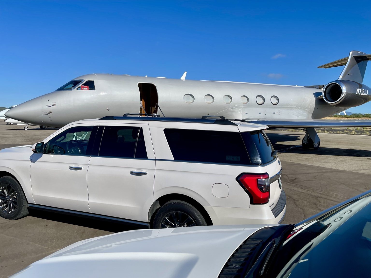 CGS private SUV beside a private aircraft at Cabo San Lucas International Airport
